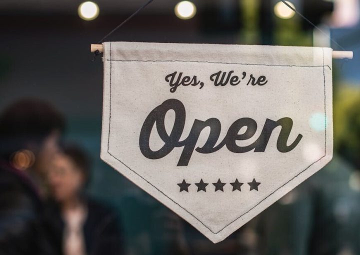 Sign that says "yes, we're open."